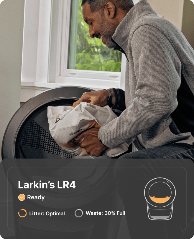 Man filling Litter-Robot 4 with litter.