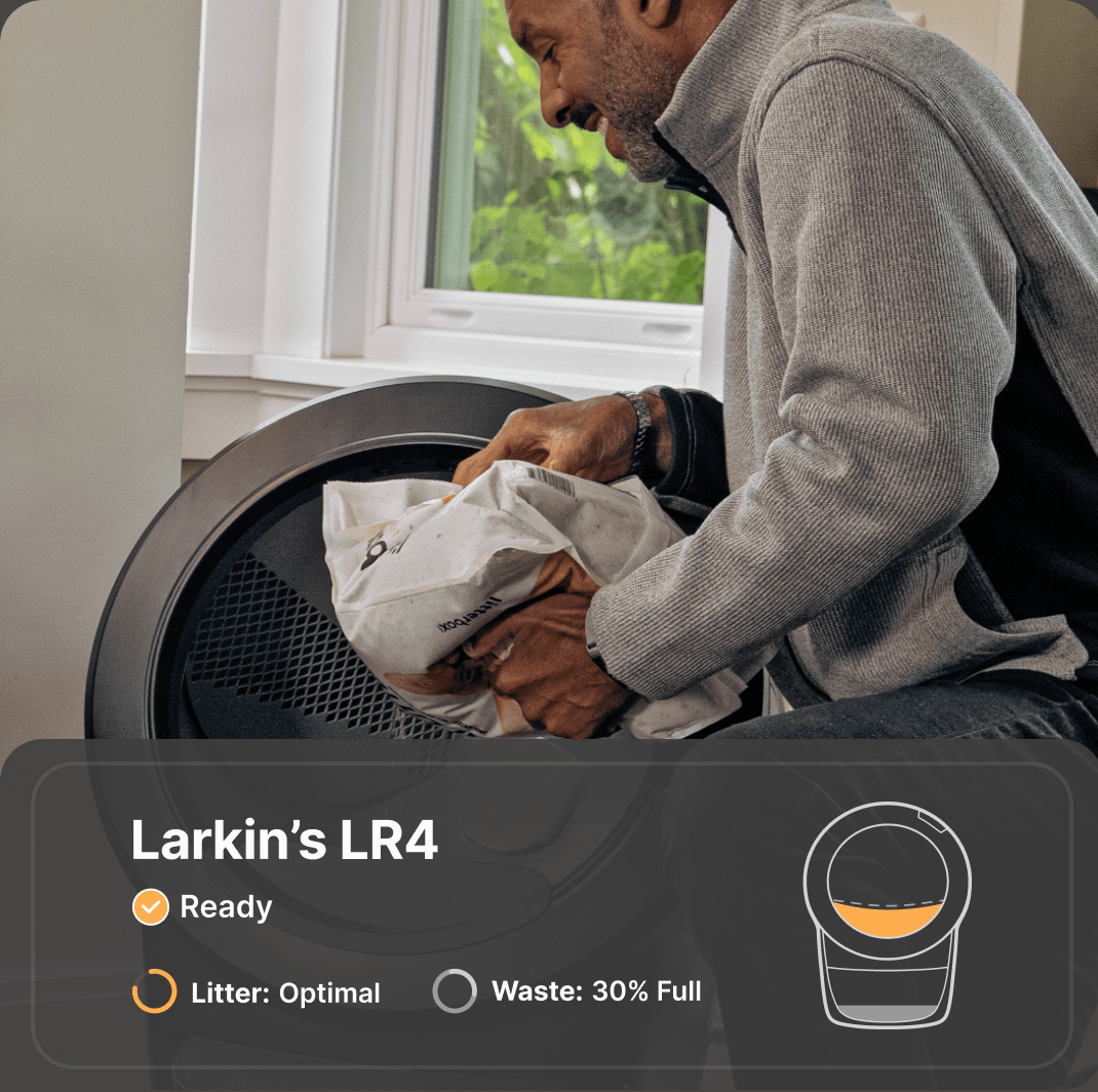 Man filling Litter-Robot 4 with litter.